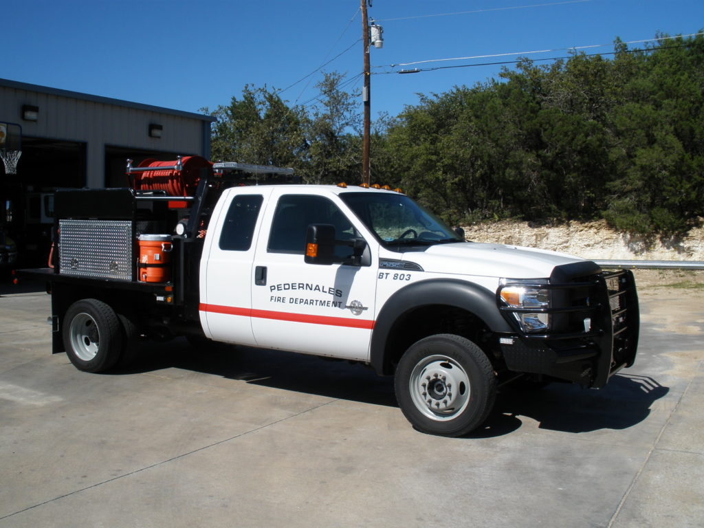 Image of Brush Truck 803 parked in front of Station 803